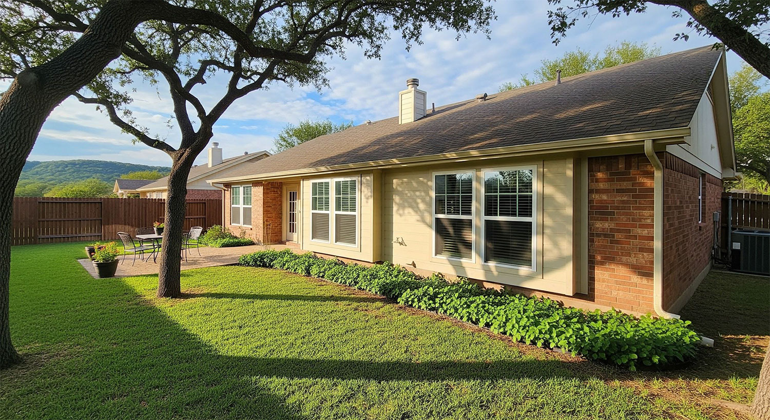 Leon Valley home showing completed window upgrade from rear view